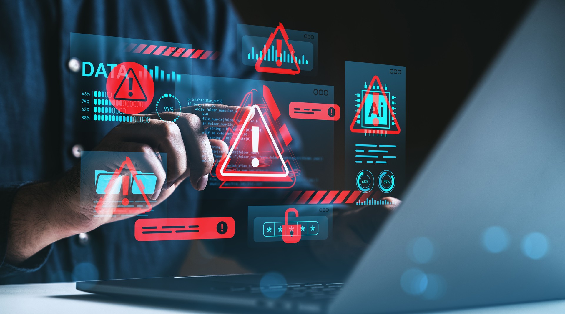 Cybersecurity threat warning concept with holographic red alert symbols over hands using laptop in dark environment, illustrating data protection risks.